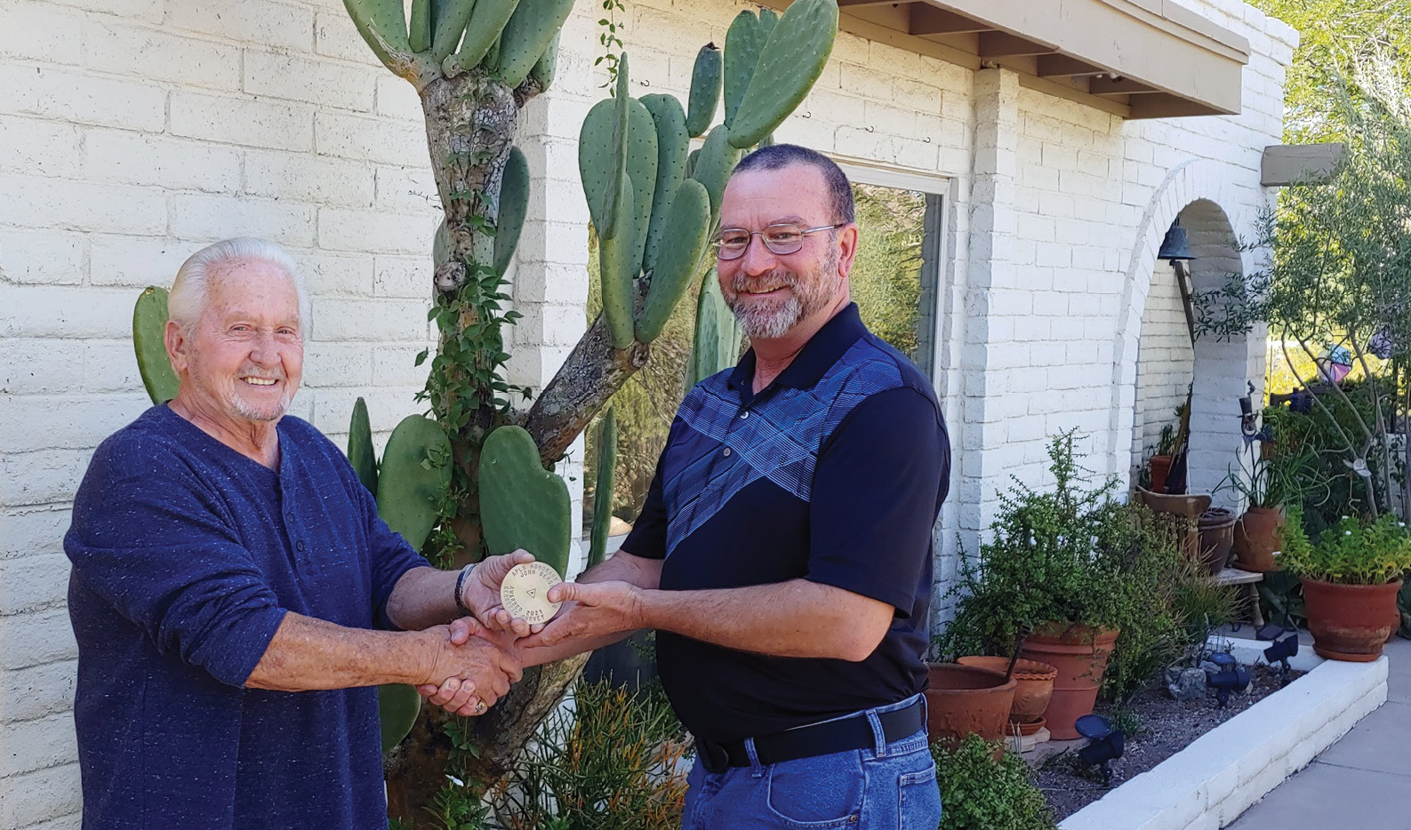 The mark (above and on the cover) was constructed by the Arizona Professional Land Surveyors to honor lifelong surveying advocate John Bergeson (left) and presented by Brian Fisher (right). We thank him for his decades of dedication and hope that this mark will serve as an enduring reminder of his excellence in service. Thanks also to Surv-Kap in Tucson AZ for creating a great looking brass cap!